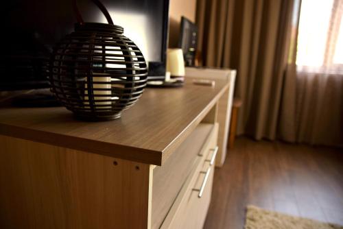 a table with a lamp on top of it at Guest House Via in Bitola