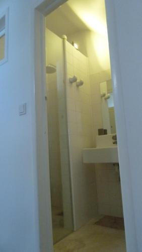 a bathroom with a shower and a sink at ribeira dos marinheiros azul in Sintra
