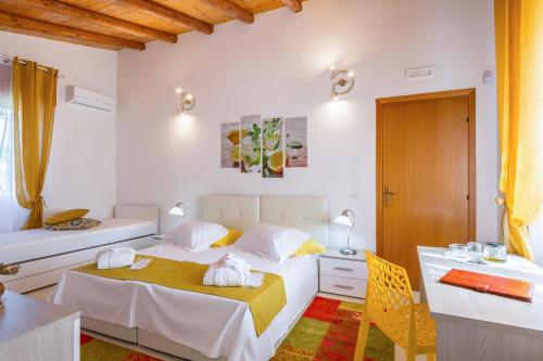 A bed or beds in a room at VILLA GIUMMARITO B&B