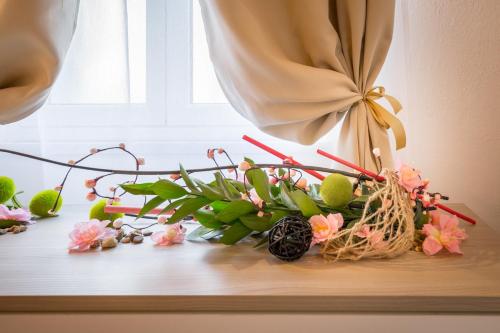 a bunch of flowers sitting on a window sill at Villa Giummarito in Scicli