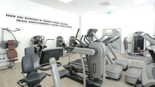 a gym with several treadmills and cardio machines at Ecumano Space in Naples