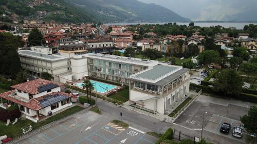 an aerial view of a town with a building and a pool at Hotel Vischi in Domaso