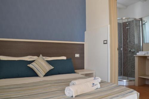 Ένα ή περισσότερα κρεβάτια σε δωμάτιο στο Affittacamere Torre Lapillo