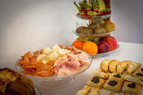 a table with three bowls of different types of food at Villa Giummarito in Scicli