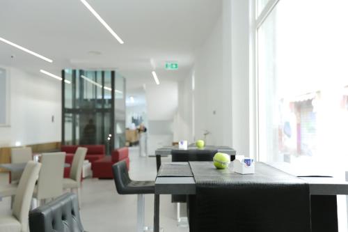 a room with a table with a ball on it at Ecumano Space in Naples