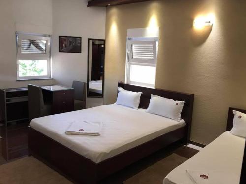 Postel nebo postele na pokoji v ubytování Hotel Millenium2