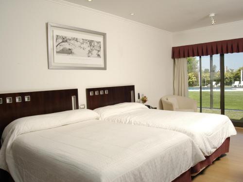 Кровать или кровати в номере Hotel Camberland