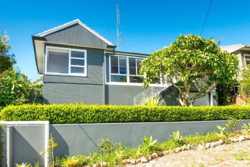 a house with a fence in front of it at Victor Parade 5 in Shoal Bay