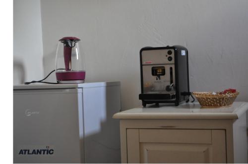 a coffee machine sitting on top of a counter at B&B Pubulos in Olbia