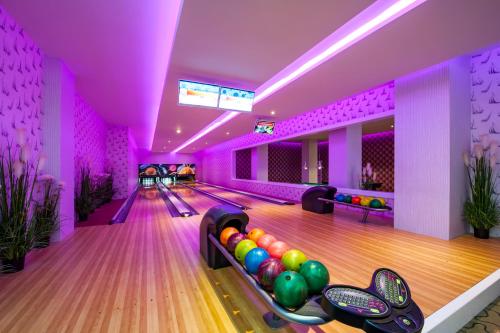 a bowling alley with balls on the lanes at Granada Luxury Belek - Family Kids Concept in Belek