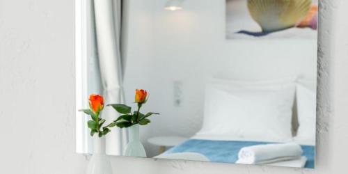 Una cama o camas en una habitación de Nostos