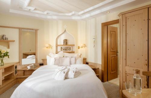 Posteľ alebo postele v izbe v ubytovaní Hotel Macun, Vent im Ötztal