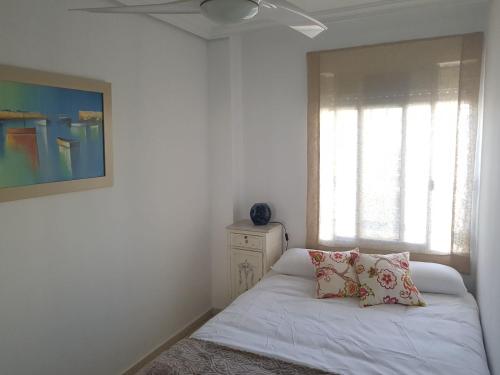 Llit o llits en una habitació de Luminoso y amplio apartamento