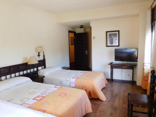 Een bed of bedden in een kamer bij Hotel Restaurante Las Galias
