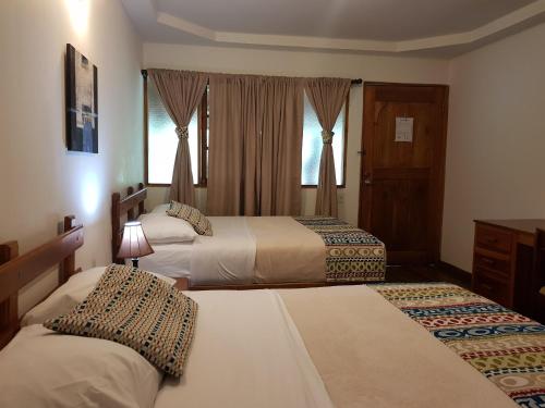 En eller flere senger på et rom på Hotel Dos Rios