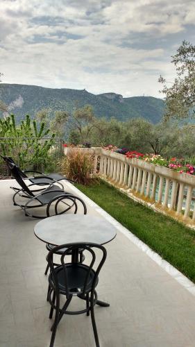 a row of tables and chairs on a patio at La vie est belle in Finale Ligure