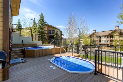 a deck with two hot tubs on a house at La Casa in Steamboat Springs