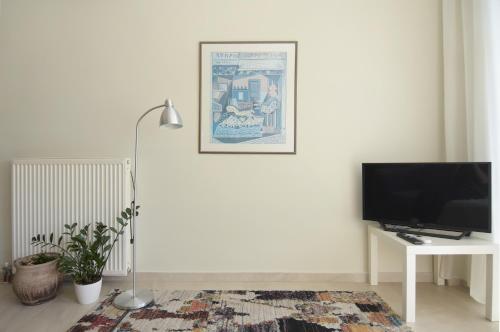 A television and/or entertainment centre at Christini Apartment