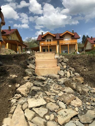 a house being built with a stone path in front at Berghaus Christel, bergbeek in grote tuin in Arnoldstein