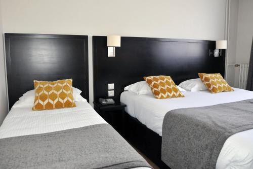 Katil atau katil-katil dalam bilik di Hôtel Des Quatrans