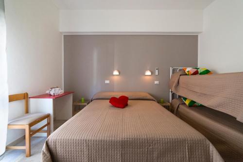 Giường trong phòng chung tại Bel Soggiorno