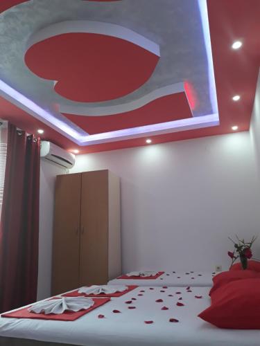 a bedroom with a ceiling with a pepsi sign at Apartments Aza in Dobra Voda