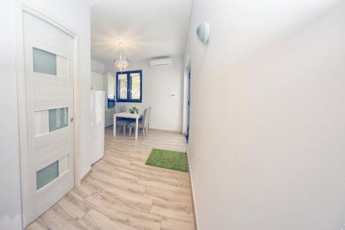a hallway with a door leading to a dining room at Villa C Luxury Estate in SantʼAntonio Abate