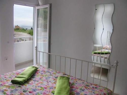 Postel nebo postele na pokoji v ubytování Apartmani Vukmanovic