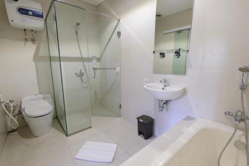 Ванная комната в Puri Padma Hotel