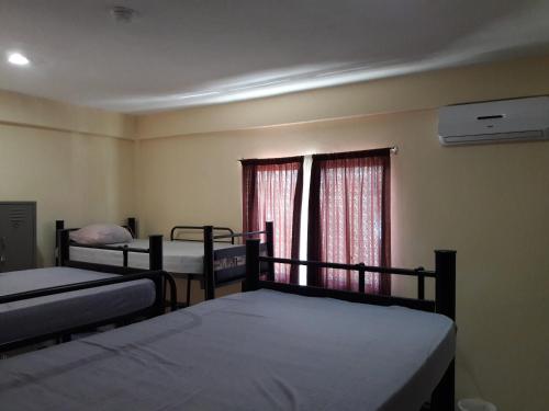מיטה או מיטות בחדר ב-Alme Hostel