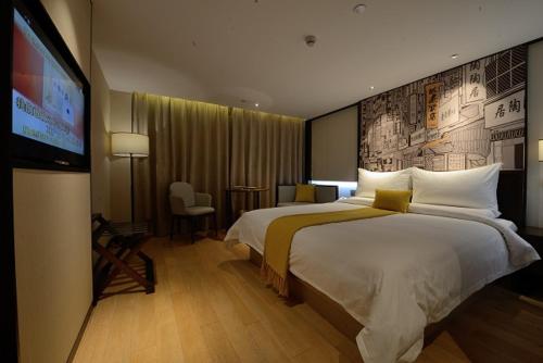 En eller flere senger på et rom på Guangzhou City Join Hotel Shipai Qiao Branch