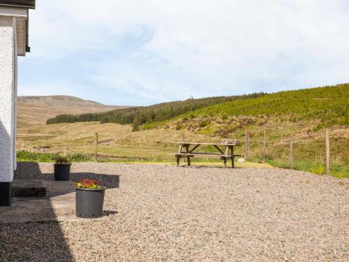 a wooden picnic table sitting on top of a hill at Shepherds' Retreat in Greencastle