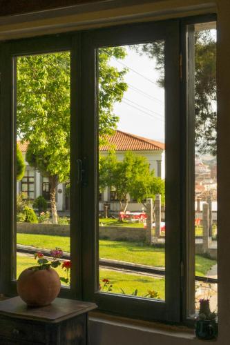 a window with a view of a yard at Elaia Hotel in Bergama