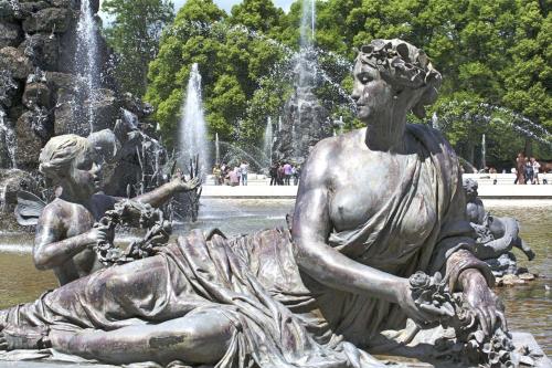 a statue of two women sitting in a fountain at Aerotel Versailles Saint Cyr - L'étape du Silence in Saint-Cyr-lʼÉcole