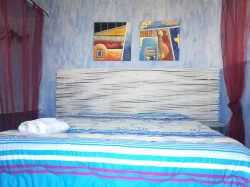 A bed or beds in a room at Villetta Degli Oleandri