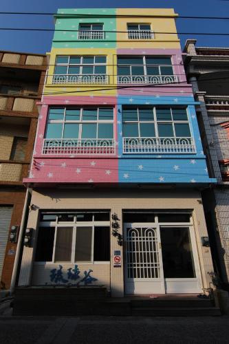 a colorful building on a city street at Liouciou Good Homestay in Xiaoliuqiu