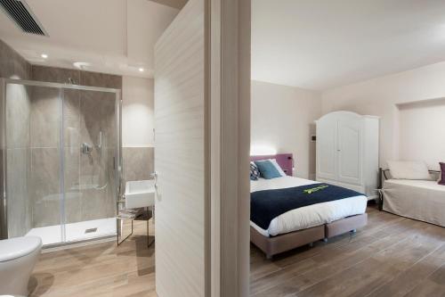 Ένα ή περισσότερα κρεβάτια σε δωμάτιο στο Angolo Divino