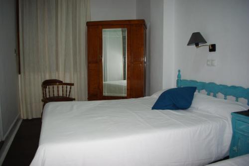 Postel nebo postele na pokoji v ubytování Hotel Lanjaron