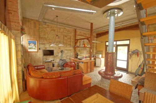 a living room with a couch and a table at Ferienwohnung TOSCANA in Dresden