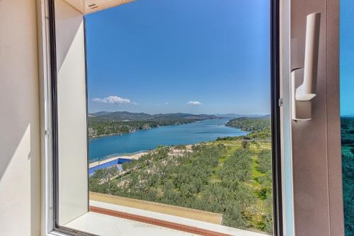 a view of a river from a window at Hotel Panorama in Šibenik