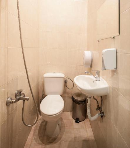 a bathroom with a toilet and a sink at Sofia Central Guest Rooms in Sofia