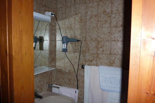a shower in a bathroom with a sink and a toilet at Haus Zwischenberger in Dölsach