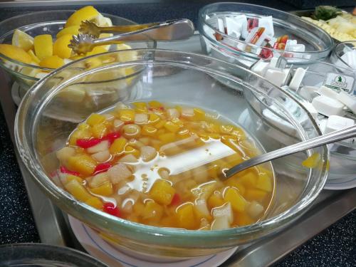 a bowl of soup with vegetables and other foods at Balneario de Ledesma in Vega de Tirados