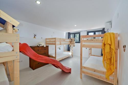 En eller flere senge i et værelse på Villa Costa Barcelona