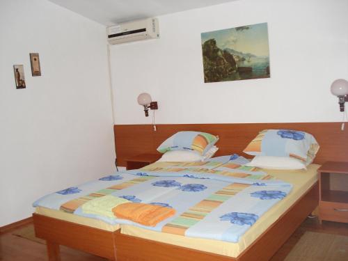 a bedroom with a large bed with at Villa Exotica in Balchik