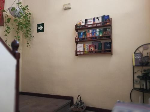 a corner of a room with a spice rack on a wall at Hotel Rural La Raya 1866 in Güimar