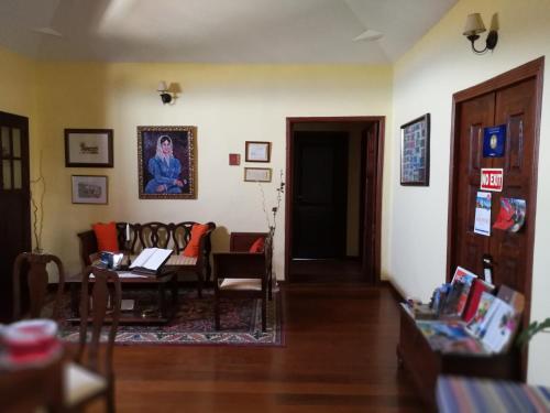 a living room with a couch and a table at Hotel Rural La Raya 1866 in Güimar