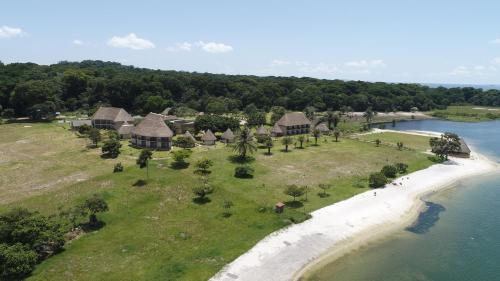 an aerial view of a resort on a beach at Victoria Forest Resort in Kalangala