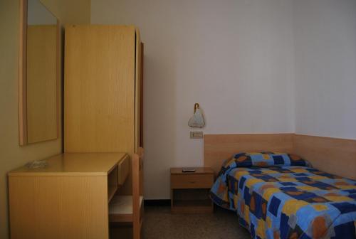 Ένα ή περισσότερα κρεβάτια σε δωμάτιο στο Hotel Aurora