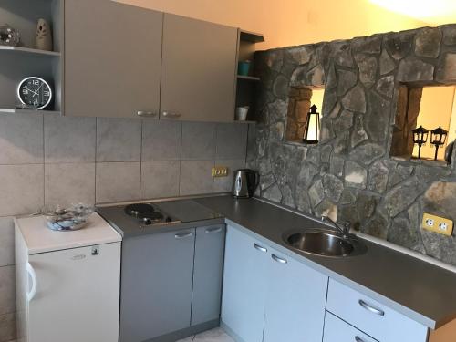 Kuchyňa alebo kuchynka v ubytovaní Ivančica Apartments